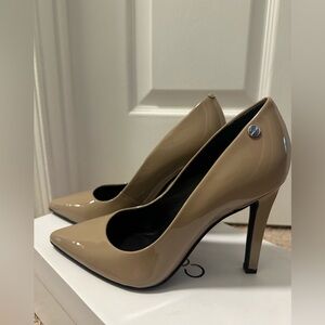Calvin Klein taupe patent pumps. Never worn